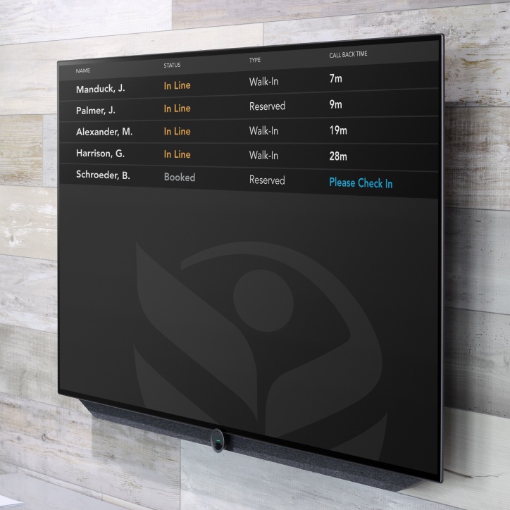 Display mounted on a wooden wall showing an app dashboard